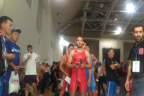 Middle Eastern males Weigh-in previous to Wrestling Tournament